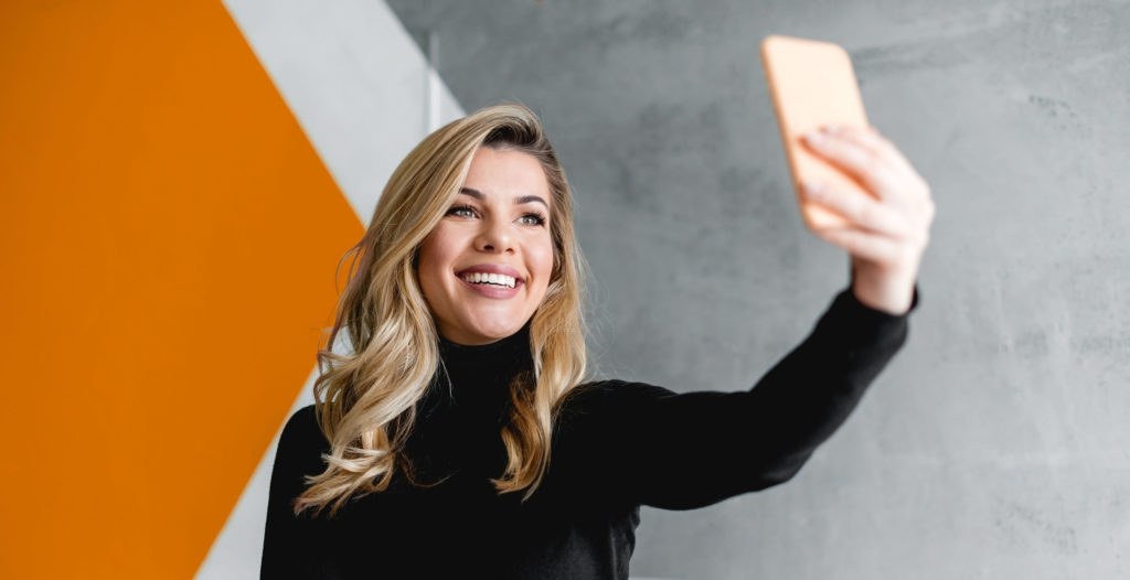 Woman holding cell phone